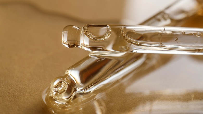 closeup of two droppers with oil