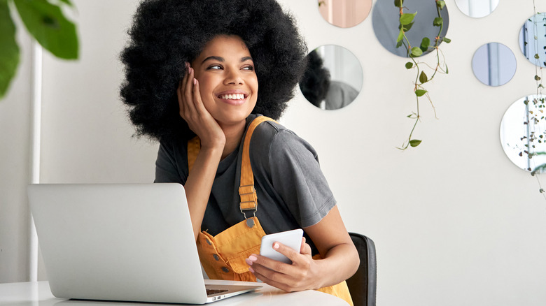 girl with afro smiling 