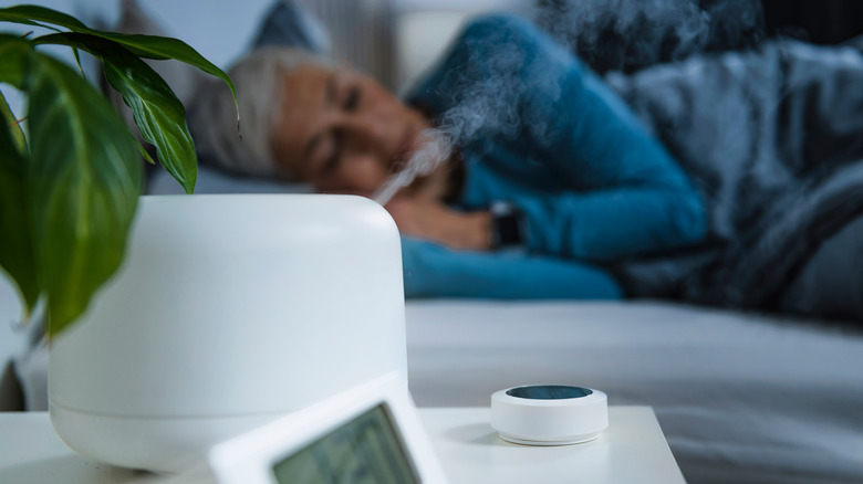 person using humidifier