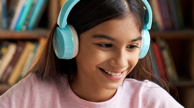 young female wearing headphones