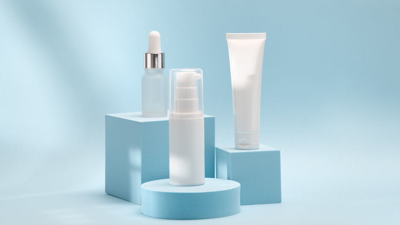 three skincare products on podiums