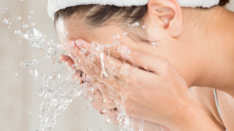 Woman washing face 