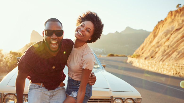 couple driving in the sunset