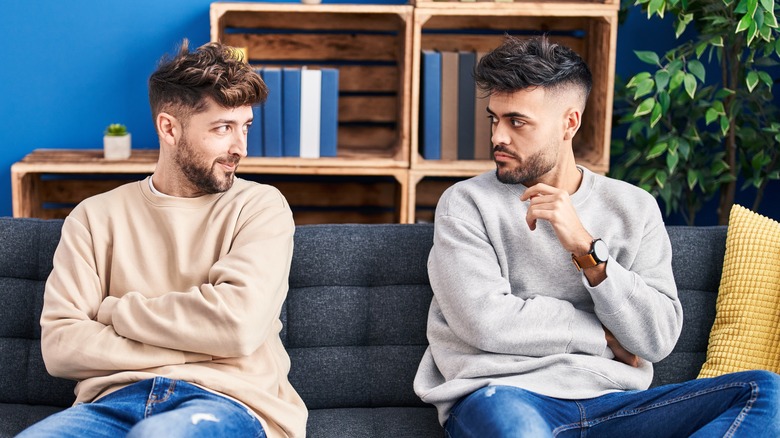 gay couple sitting on couch