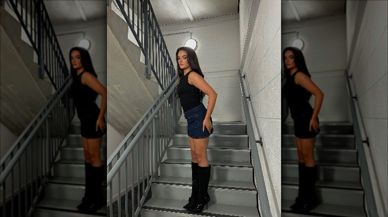 Woman posing on a stairway