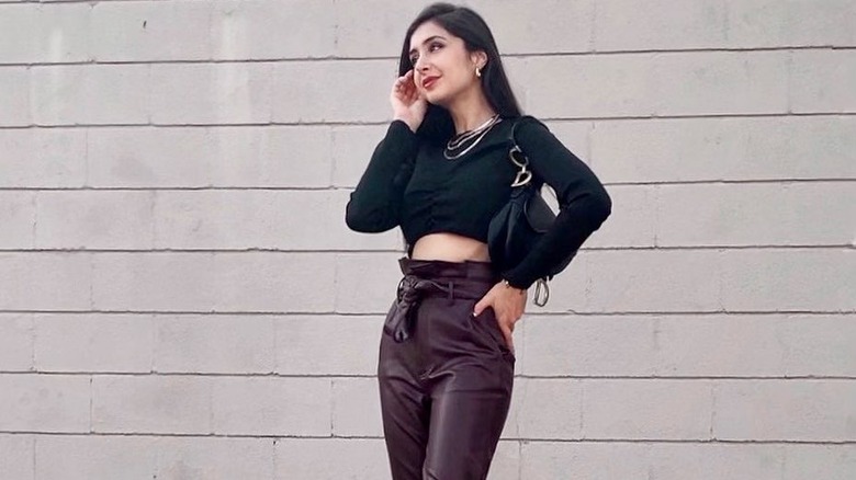 Woman crop top with high-waisted pants