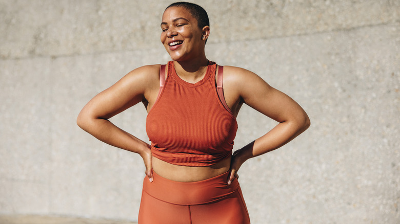 Plus-size model poses for fitness photo shoot 