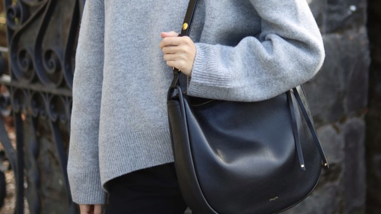 Woman carrying hobo bag