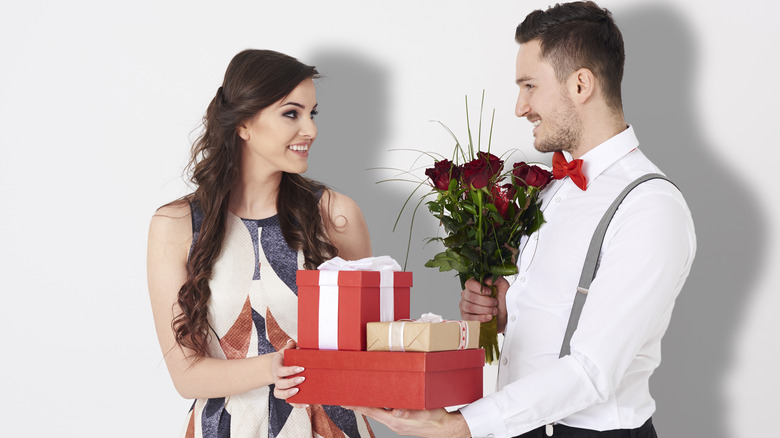man giving woman gift
