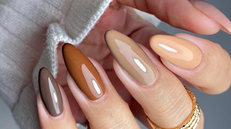 Woman with chocolate gradient nails