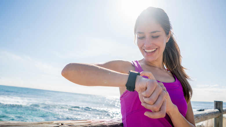 woman looking at smart watch