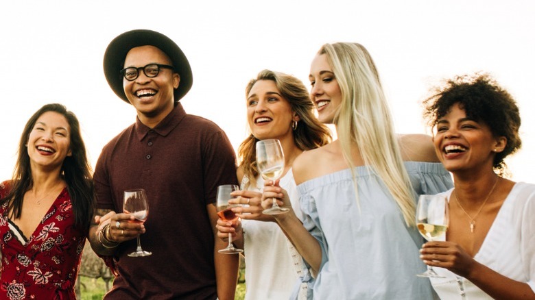 Friends drinking wine outside