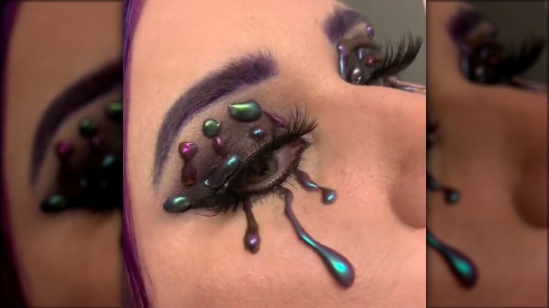 woman with hot glue eyeliner