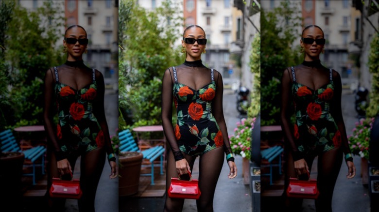 woman wearing jumpsuit under floral romper