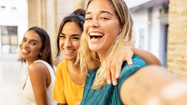 three women taking selfie