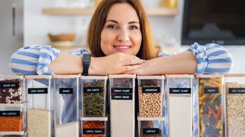 woman with organized pantry containers