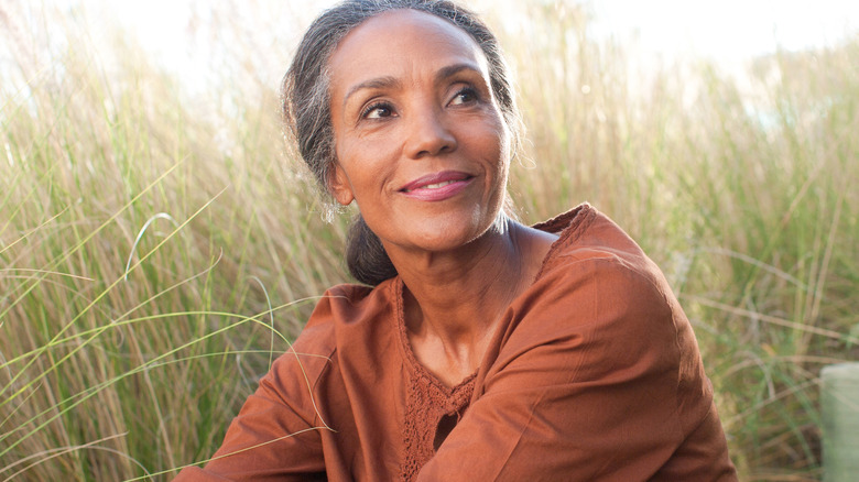 Mature Black woman enjoying nature