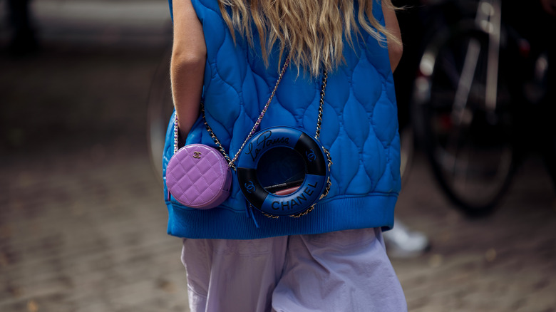 person in puffy blue vest