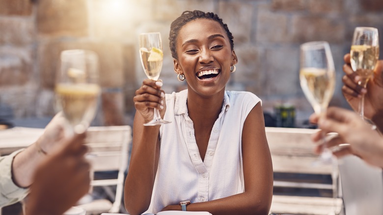 woman smiling at dinner