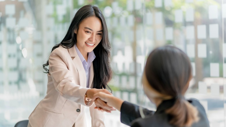 women shaking hands