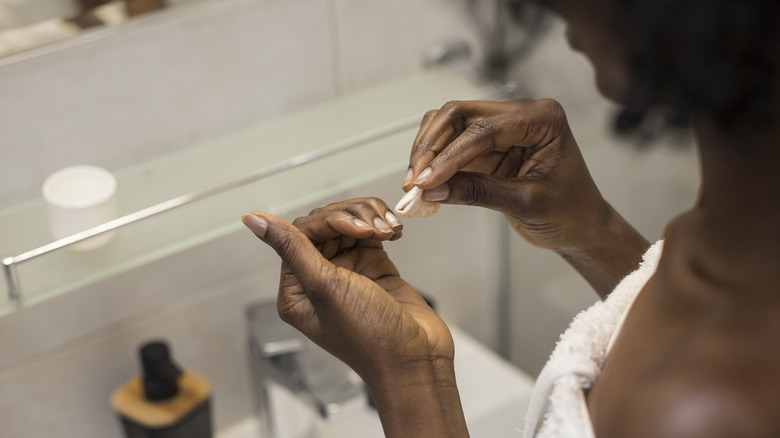 woman caring for nails