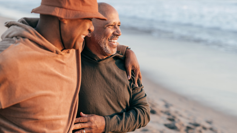 Couple embraces on beach