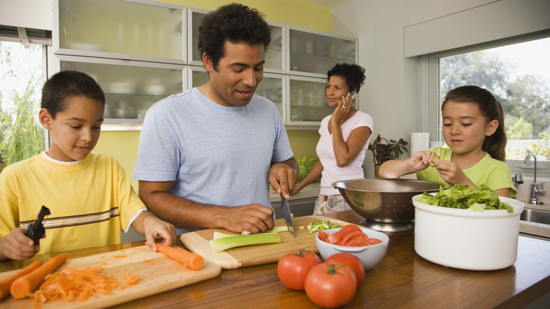 ethnic family cooking together