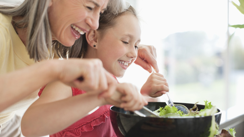 woman and young girl salad