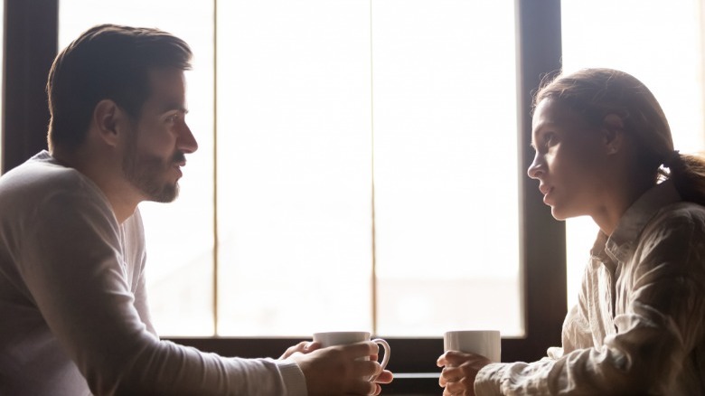 Couple having conversation at table