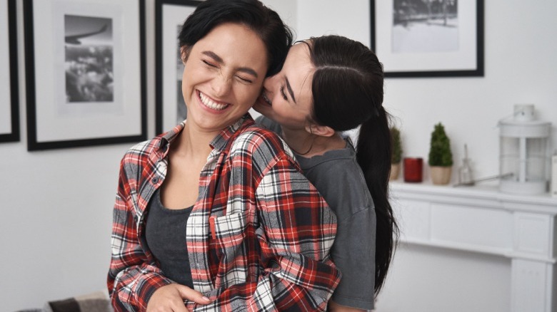 Women hugging and laughing
