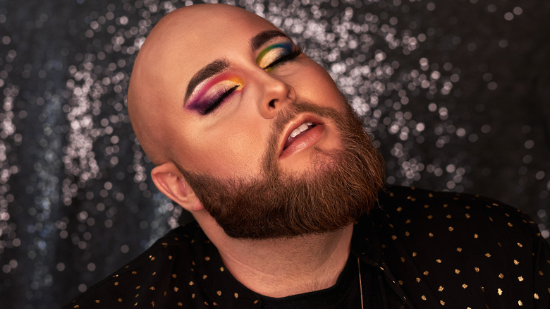 Man wearing colorful eyeshadow