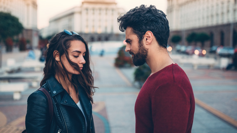 man and woman standing outside