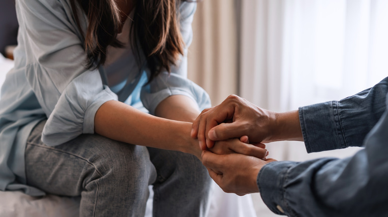 couple holding hands