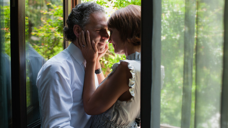 couple passionately embracing