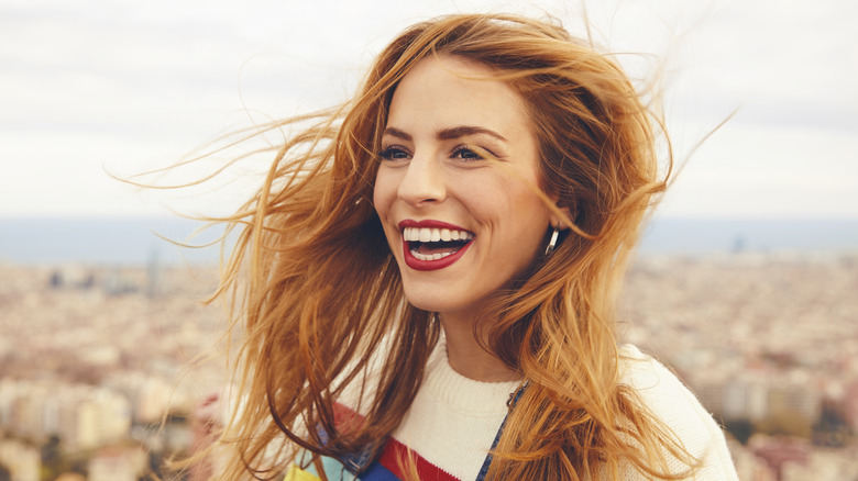 smiling woman with red hair