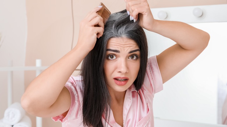 Woman combing her hair