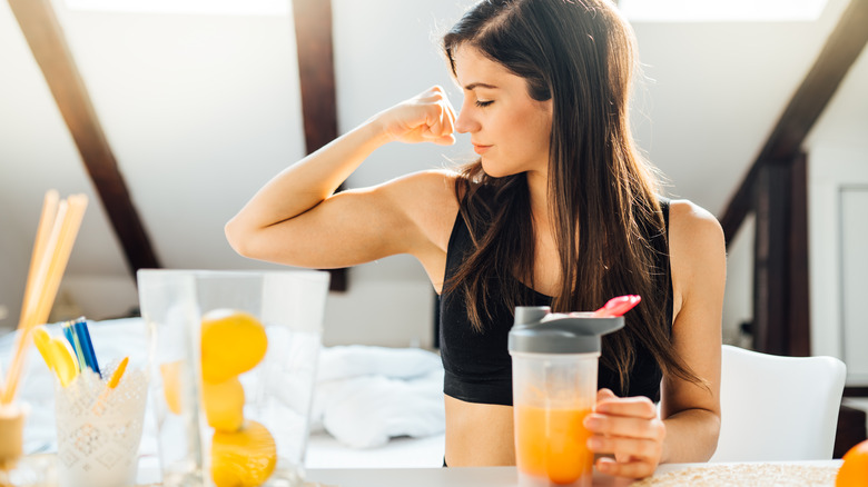 woman drinking sports drink