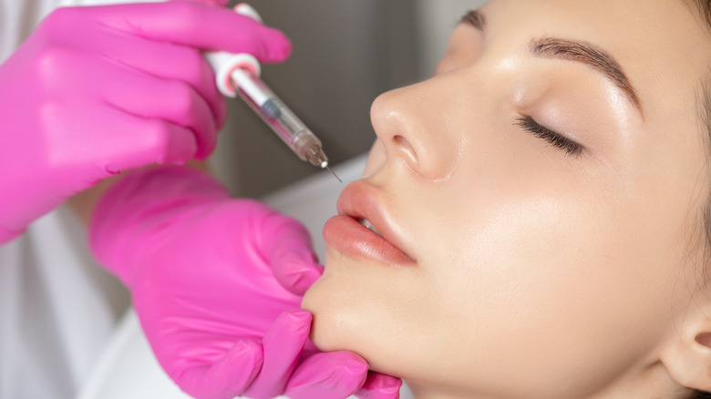 woman receiving lip injection