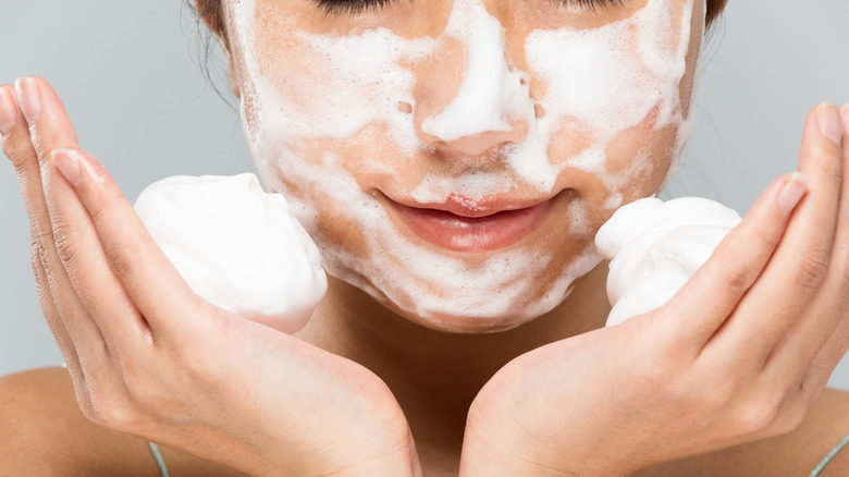 Woman washing her face