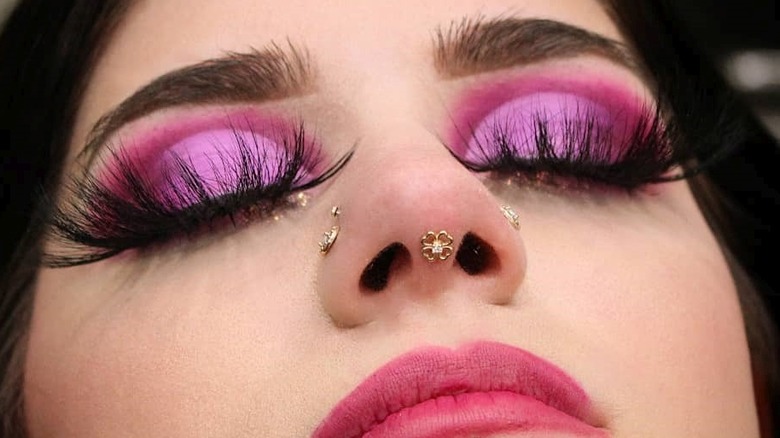 Close up of septril piercing and double nostril piercings