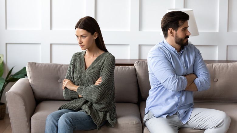 Couple looking opposite ways