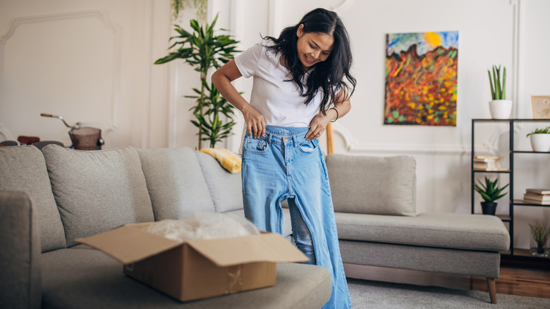 Girl trying new pair of jeans