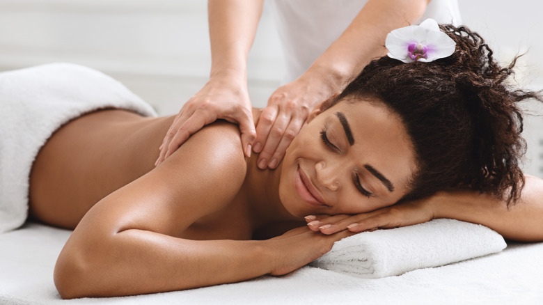 Woman receiving shoulder massage