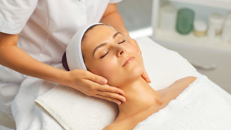 woman receiving facial treatment