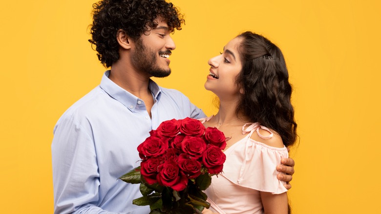 Couple holding a bouquet