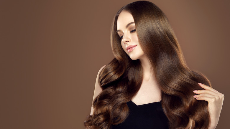 woman with glossy hair down