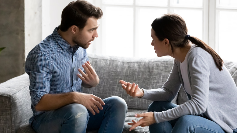 A man and woman arguing