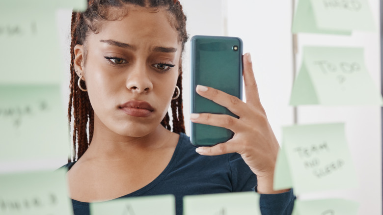 sad woman with phone