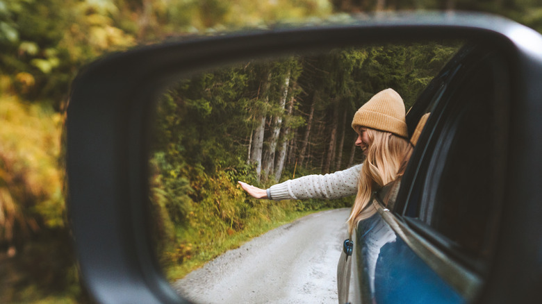 Woman on fall road trip