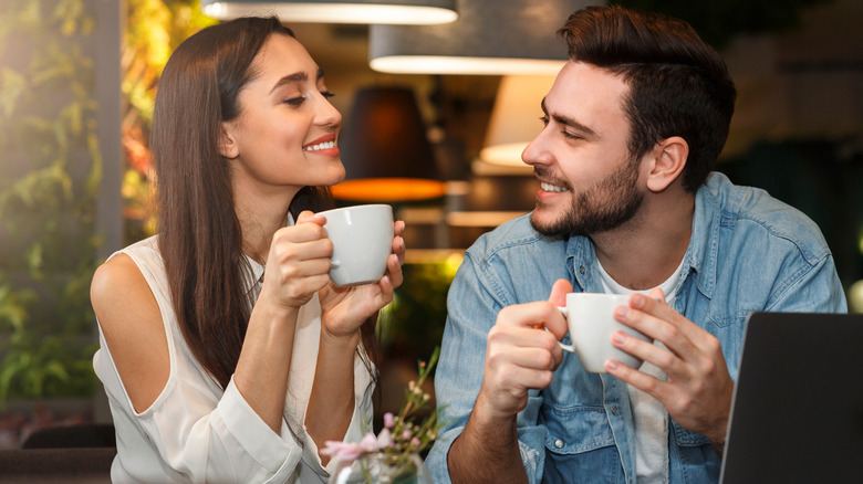 couple smiling on coffee date